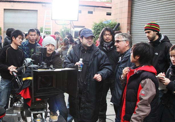 Dayyan Eng on a film set with crew